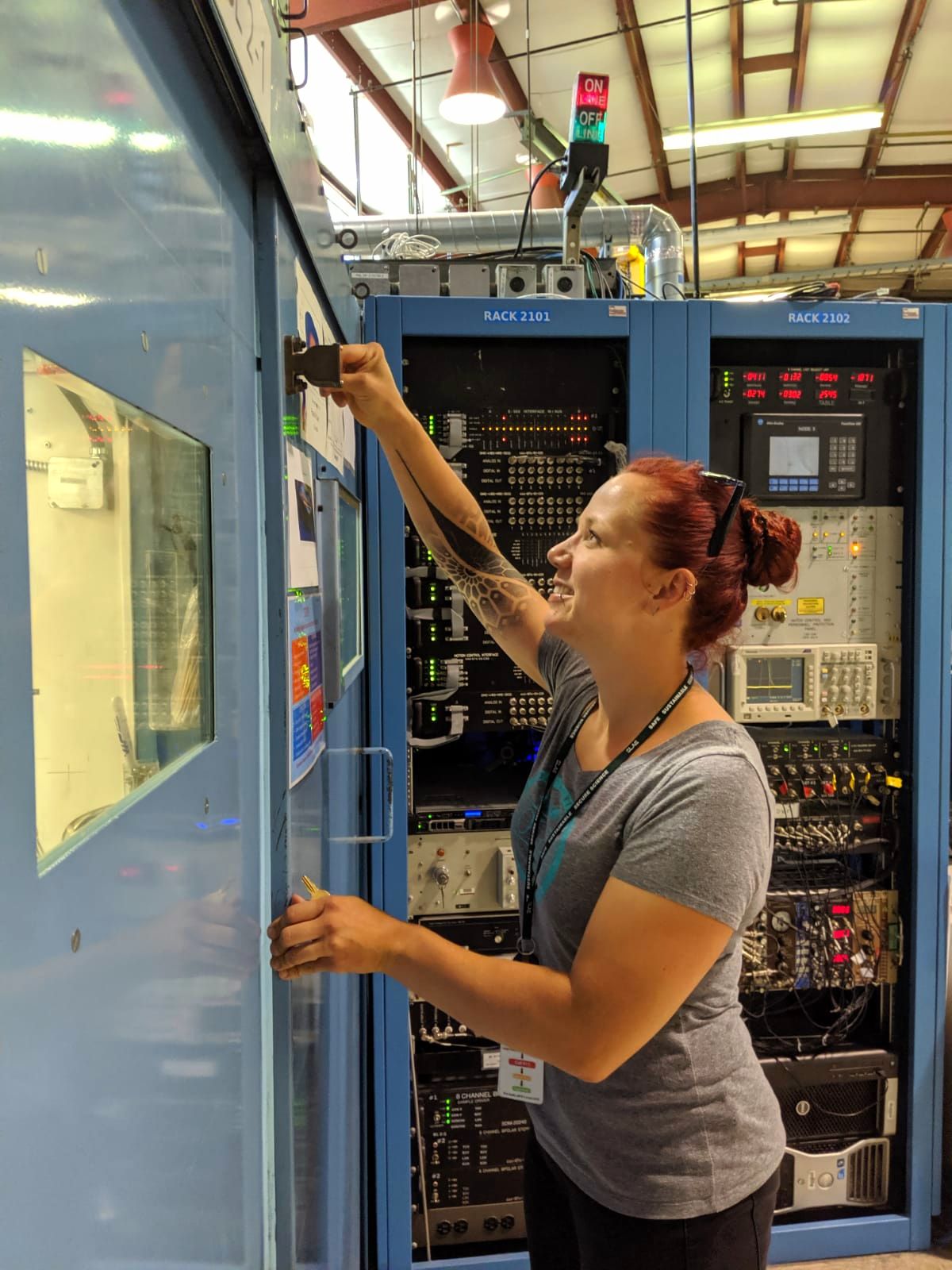 Laura Mundt closes the hutch door at one of the beam lines