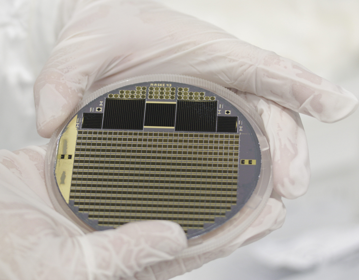 Image of a solar cell wafer with four-junction concentrator cells and test structures.