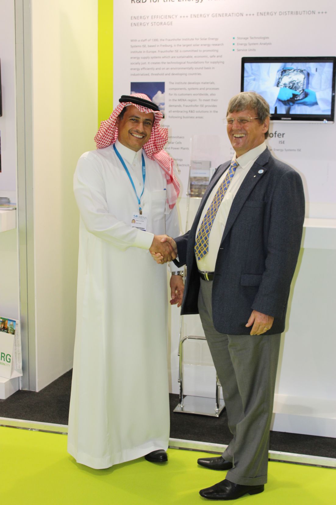 Dr. Mahar Alodan, King Abdullah City for Atomic &amp; Renewable Energy (K.A.CARE) (left) and Prof. Dr. Eicke R. Weber, Director of Fraunhofer ISE, during the signing ceremony at the German Pavillon at the World Future Energy Summit in Abu Dhabi on January 20, 2014