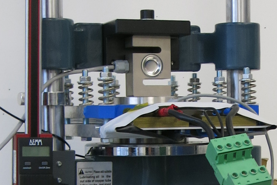 Non-destructive characterization of battery cells and pressure application during operation