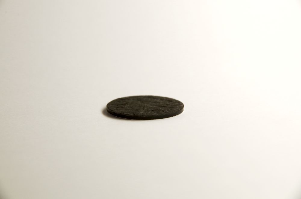 The “BEST” project is developing an electrode manufacturing process based on a dry coating process for high-throughput fabrication. The picture shows a dry-coated electrode for experimental cells (diameter 18 mm) with a thickness of approx. 2 mm.