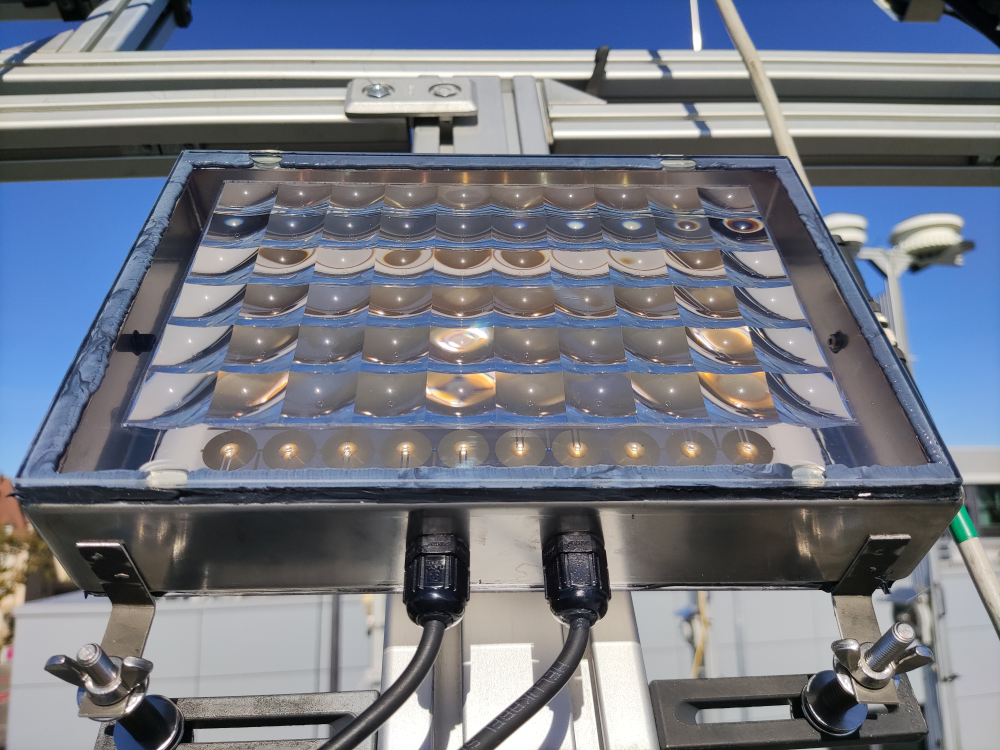 micro-CPV demonstrator module mounted on the tracking unit of the CPV test stand at Fraunhofer ISE. The aperture area of the 10x6 cell-lens unit arrangement is 205 cm².