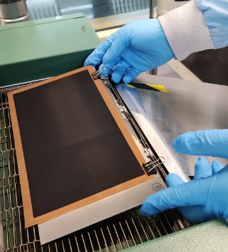 Full-format catalyst layer on decal transfer foil after the drying process in a continuous convection dryer.