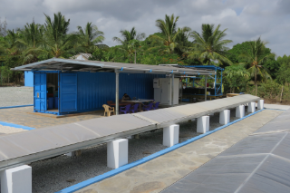 SolCoolDry system in Mwazaro with the tunnel dryers, the solar roof on the container and the ice room.