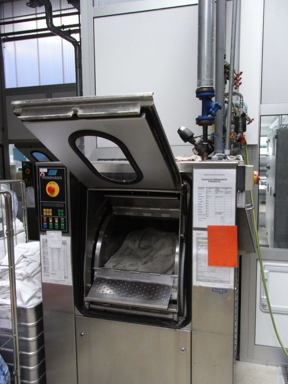 Industrial washing machine with hot water, cold water and steam connection.